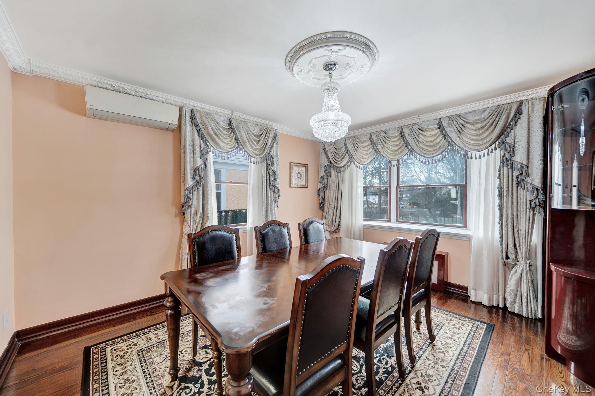 87-67 Chevy Chase Street Queens, NY 11432 - Photo 16 of 31 a view of a dining room with furniture window and wooden floor