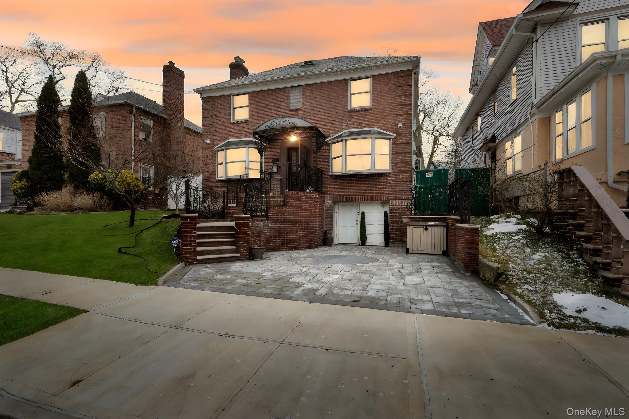 87-67 Chevy Chase Street Queens, NY 11432 - Photo 3 of 31 a front view of a house with a yard