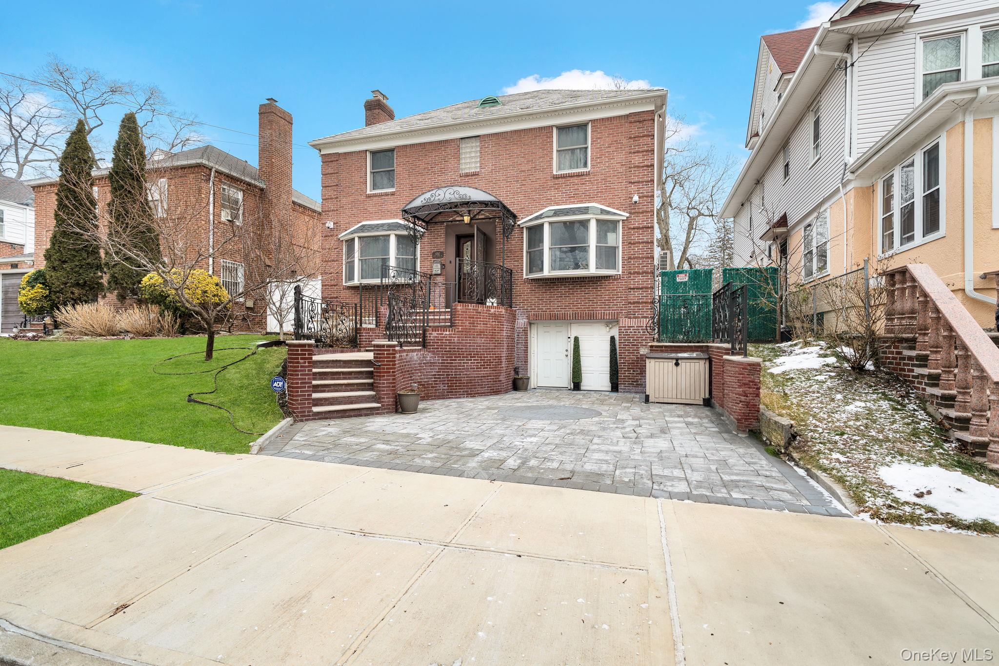 87-67 Chevy Chase Street Queens, NY 11432 - Photo 4 of 31 a front view of a house with a yard