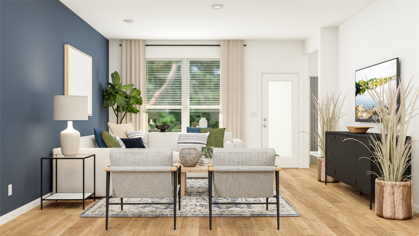 153 Sormonne Loop Kyle, TX 78640 - Photo 8 of 14 a living room with furniture potted plant and a window