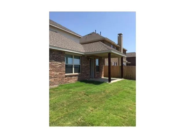 a outdoor space of building with a yard