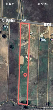 a view of a lake with a floor to ceiling window