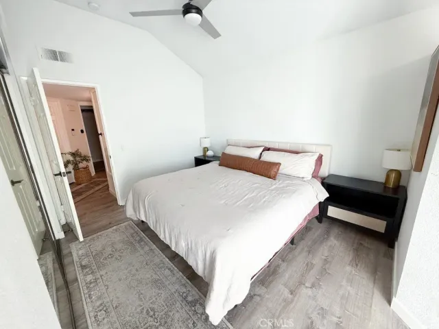 a bedroom with a bed and a walk in closet