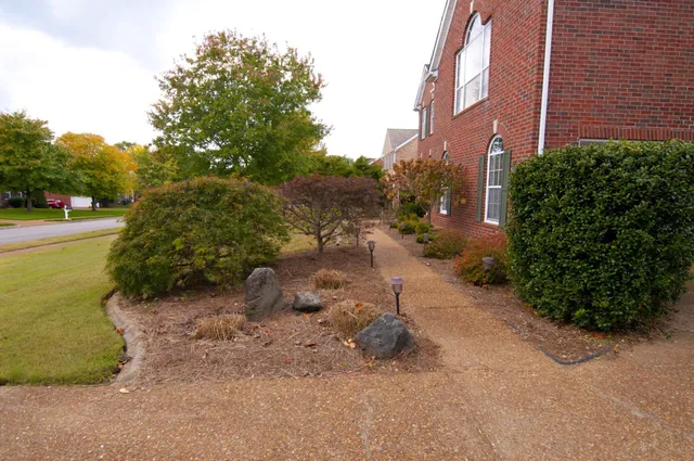 a backyard of a house with lots of green space