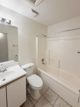 a bathroom with a sink a toilet and a bathtub