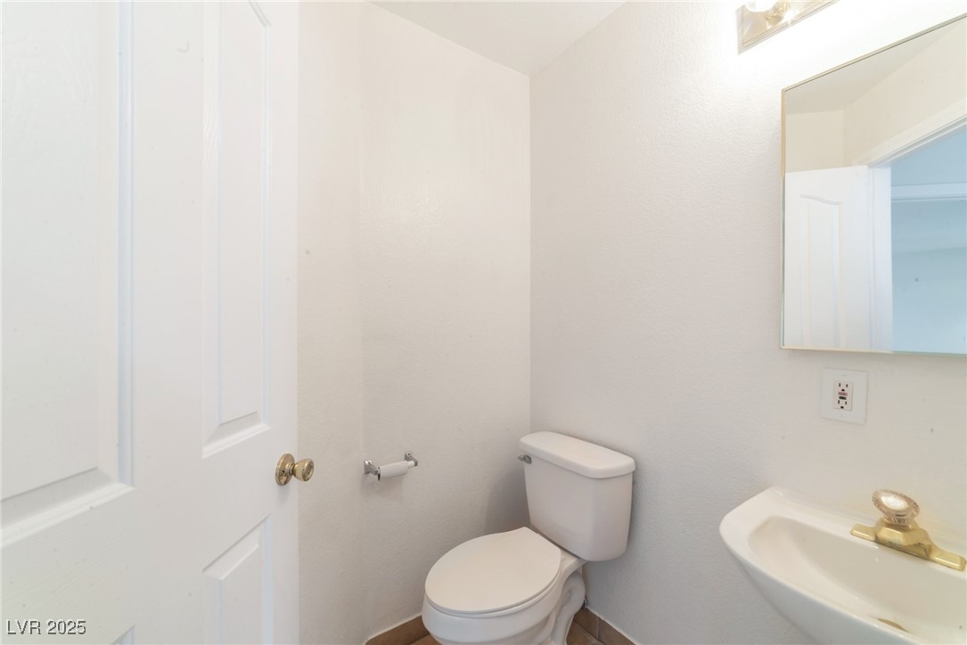 121 Golf Course Street Las Vegas, NV 89145 - Photo 11 of 15 Bathroom with toilet and a sink