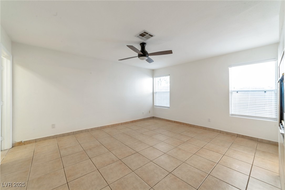 121 Golf Course Street Las Vegas, NV 89145 - Photo 12 of 15 Spare room with visible vents, ceiling fan, and li