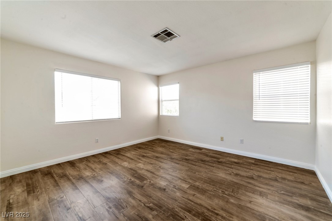 121 Golf Course Street Las Vegas, NV 89145 - Photo 7 of 15 Spare room with visible vents, baseboards, and dar