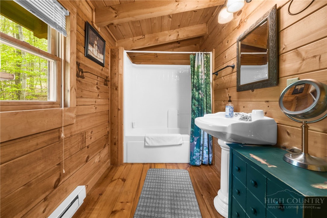 259 Greenbriar Road Beech Mountain, NC 28604 - Photo 23 of 41 a bathroom with a sink and a mirror