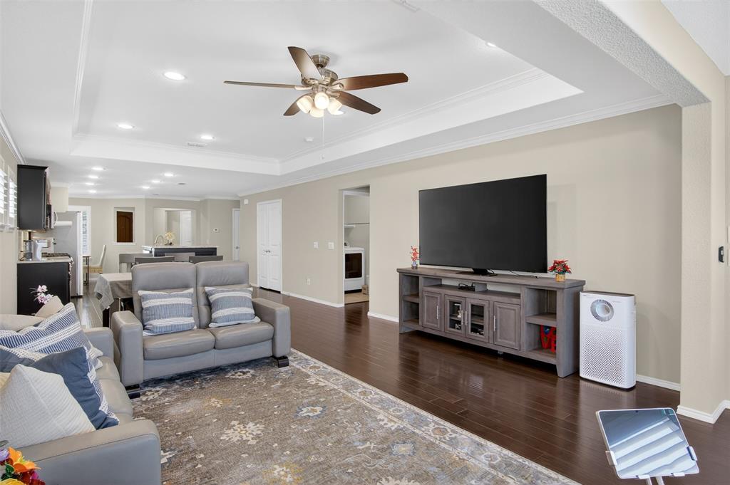 8978 Shore Crest Road Frisco, TX 75036 - Photo 13 of 40 a living room with furniture and a flat screen tv