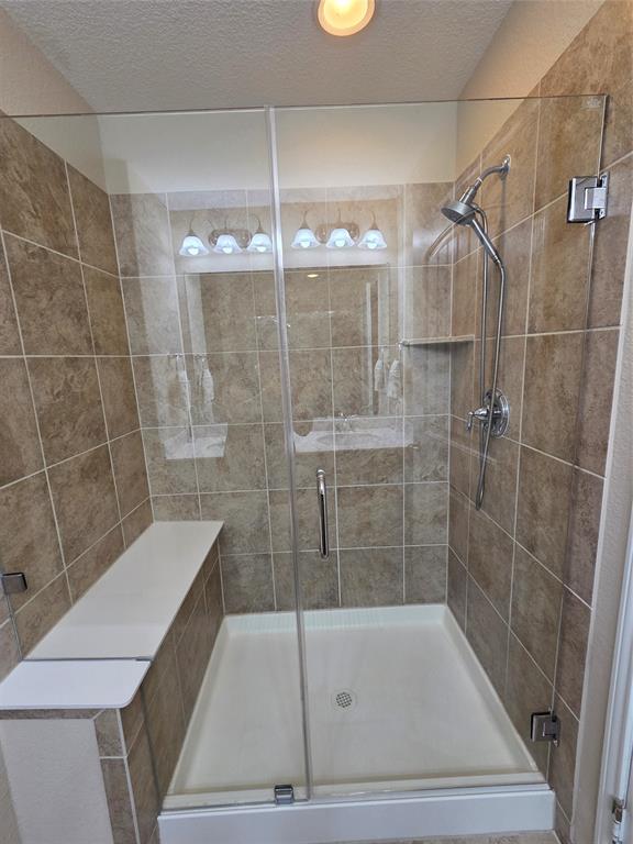 8978 Shore Crest Road Frisco, TX 75036 - Photo 19 of 40 a bathroom with a shower and a sink