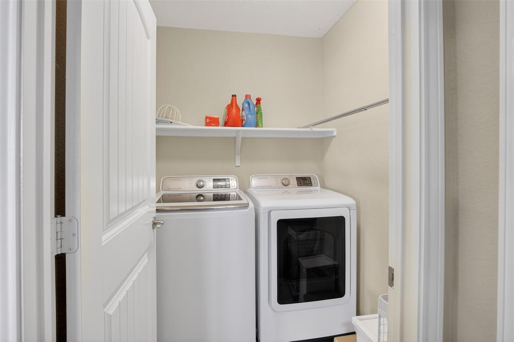 8978 Shore Crest Road Frisco, TX 75036 - Photo 21 of 40 a utility room with dryer and washer
