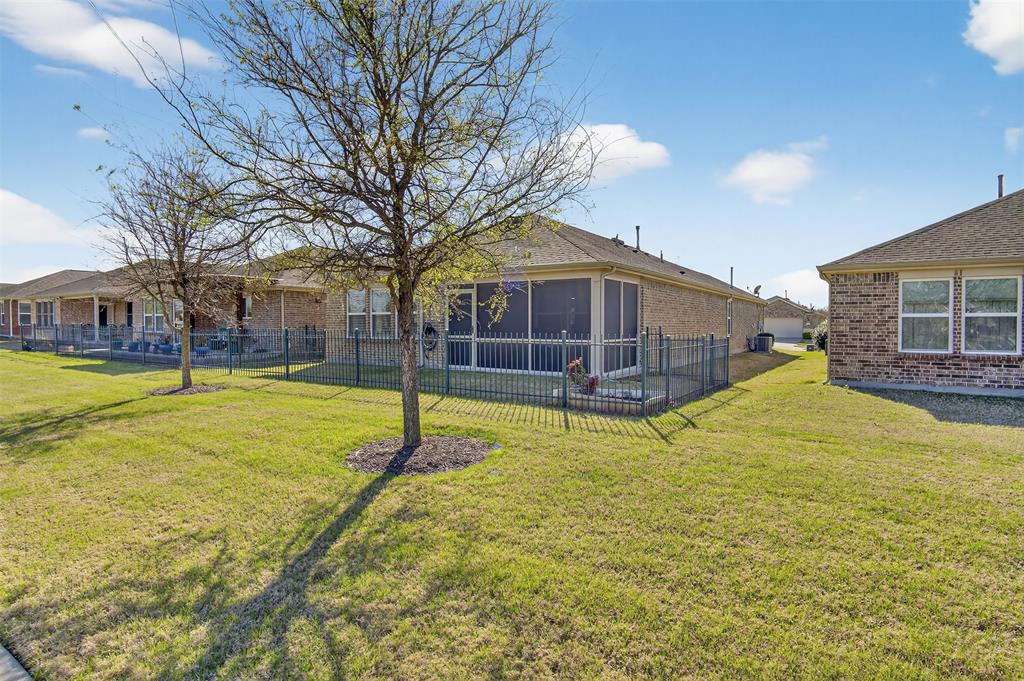 8978 Shore Crest Road Frisco, TX 75036 - Photo 26 of 40 a view of a house with swimming pool and yard