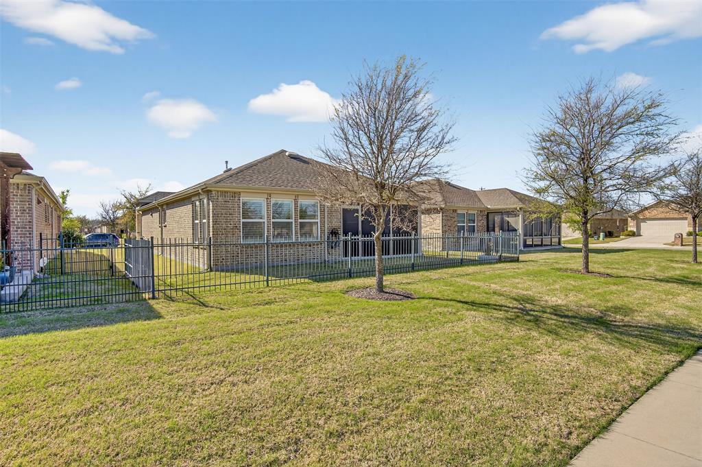 8978 Shore Crest Road Frisco, TX 75036 - Photo 27 of 40 a view of a house with a yard and swimming pool