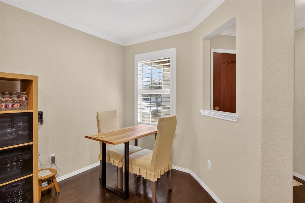 8978 Shore Crest Road Frisco, TX 75036 - Photo 5 of 40 a view of a room with furniture wooden floor and window