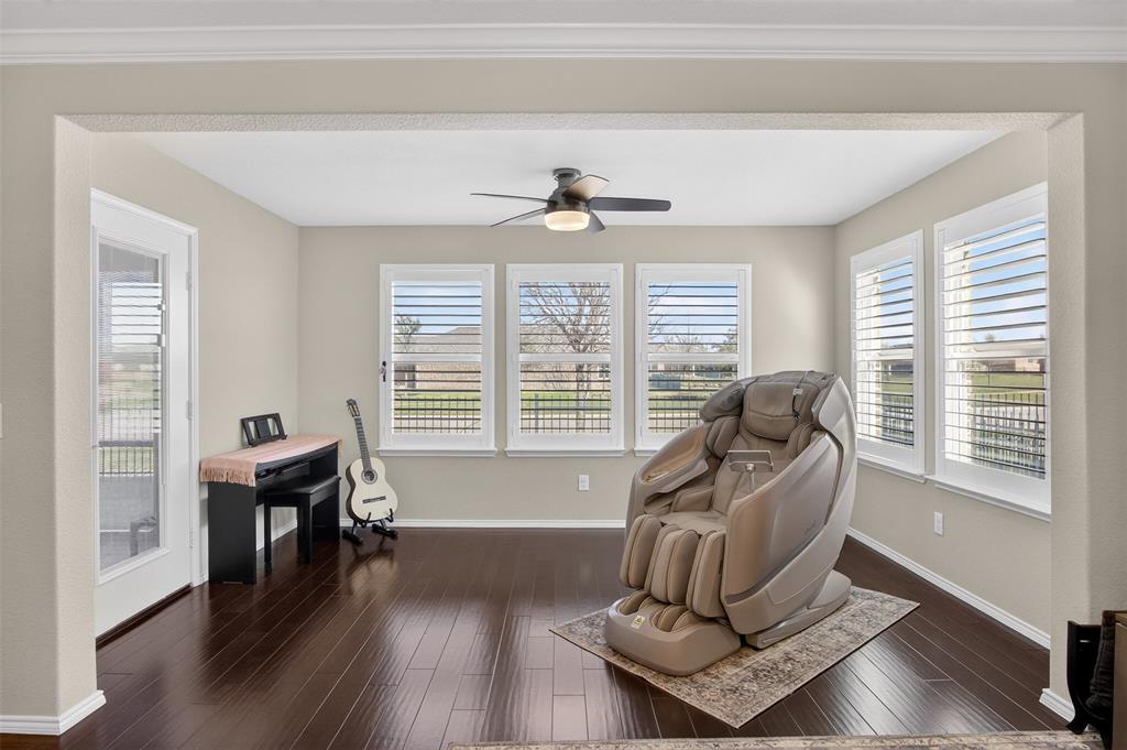 8978 Shore Crest Road Frisco, TX 75036 - Photo 10 of 40 a living room with furniture and wooden floor