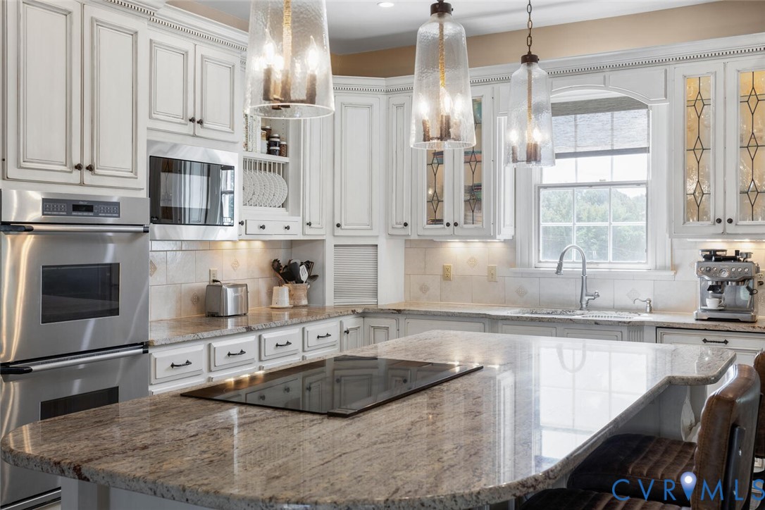 516 Mt Hermon Road Midlothian, VA 23112 - Photo 12 of 50 a kitchen with stainless steel appliances granite countertop a sink a stove and a refrigerator