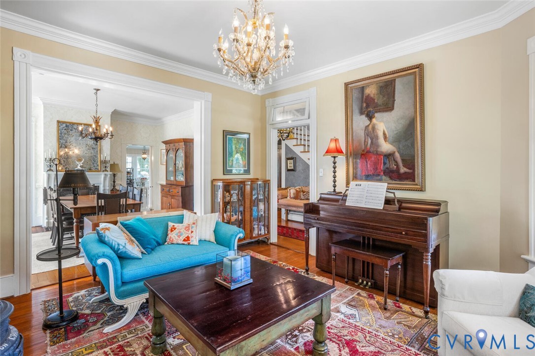 516 Mt Hermon Road Midlothian, VA 23112 - Photo 20 of 50 a living room with furniture a fireplace and a chandelier