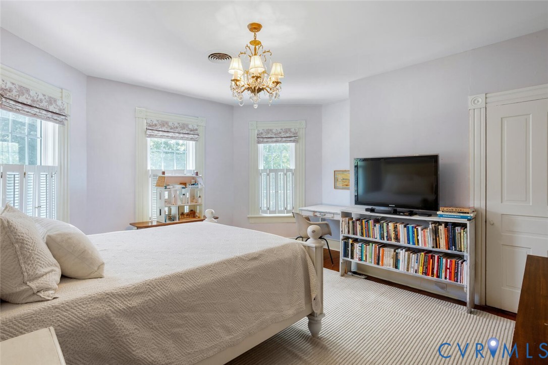 516 Mt Hermon Road Midlothian, VA 23112 - Photo 29 of 50 a bedroom with a bed and a flat screen tv