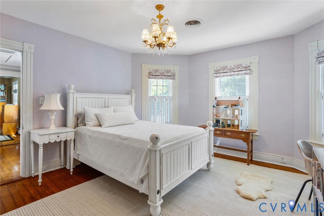 516 Mt Hermon Road Midlothian, VA 23112 - Photo 30 of 50 a bedroom with a bed and a chandelier