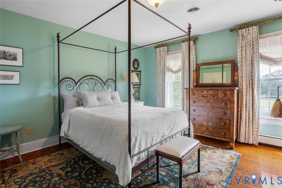 516 Mt Hermon Road Midlothian, VA 23112 - Photo 32 of 50 a bedroom with a bed and a mirror