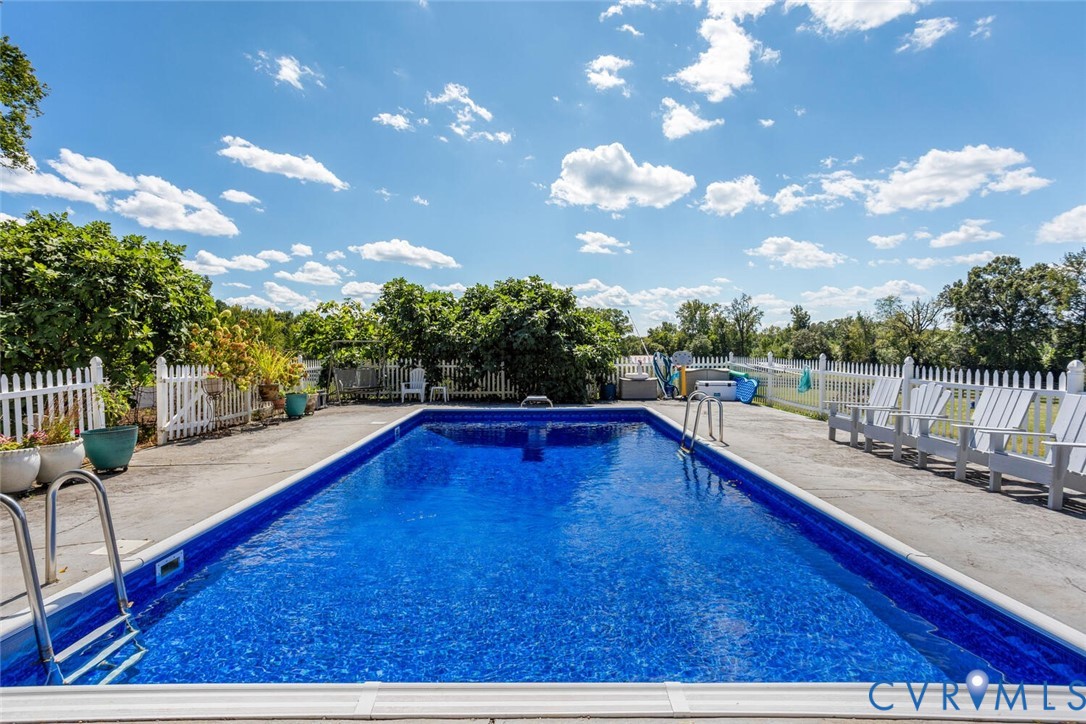 516 Mt Hermon Road Midlothian, VA 23112 - Photo 36 of 50 a view of a swimming pool with a lounge chairs