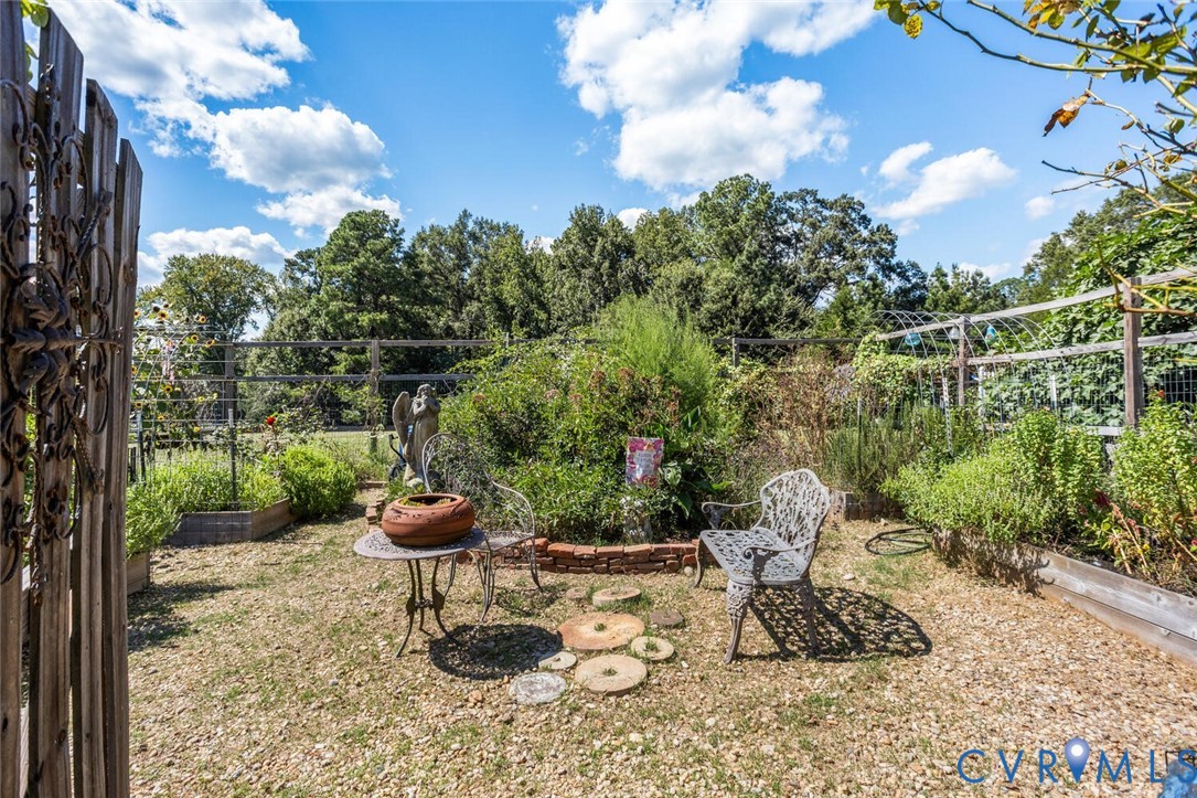 516 Mt Hermon Road Midlothian, VA 23112 - Photo 39 of 50 a view of a backyard with plants and outdoor seating