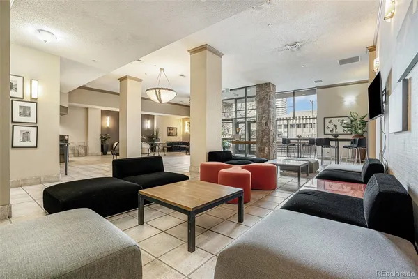 a view of a patio with a table and chairs