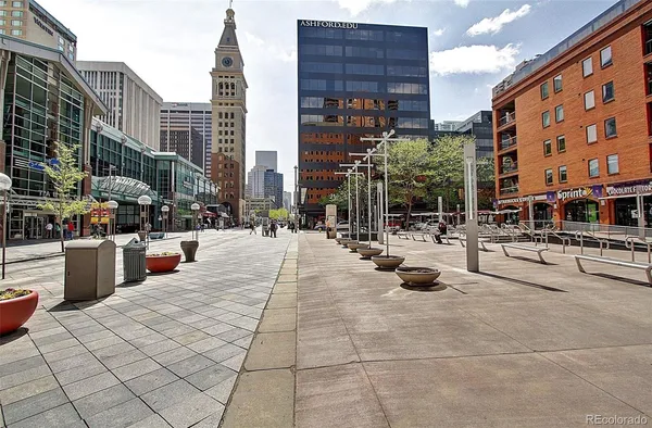 a view of a street with a building in the background