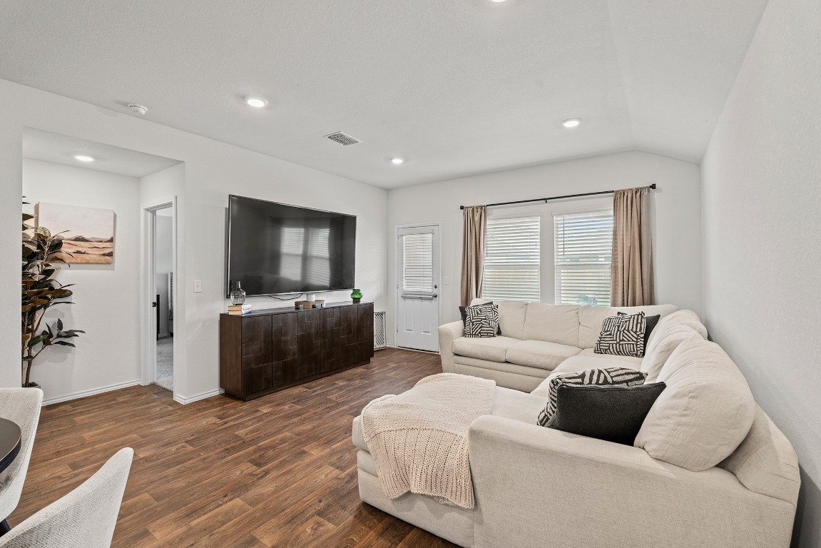 11817 Rush Lane Elgin, TX 78621 - Photo 11 of 30 a living room with furniture and a flat screen tv