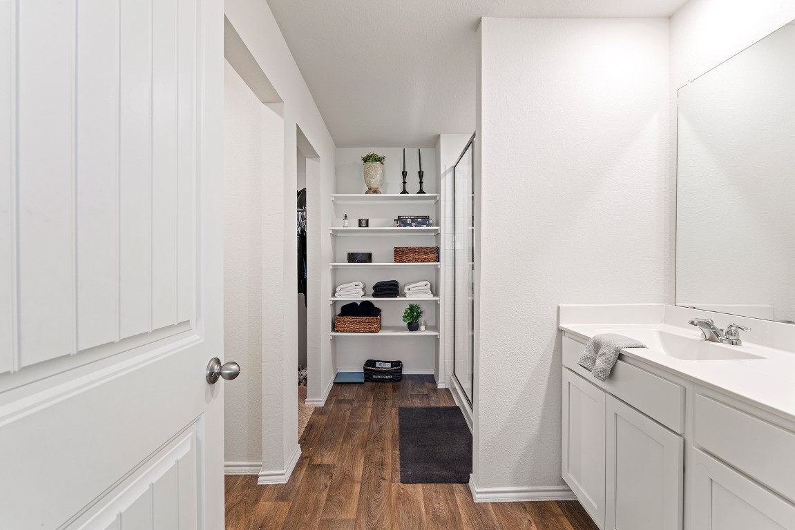 11817 Rush Lane Elgin, TX 78621 - Photo 14 of 30 a bathroom with a sink and a mirror