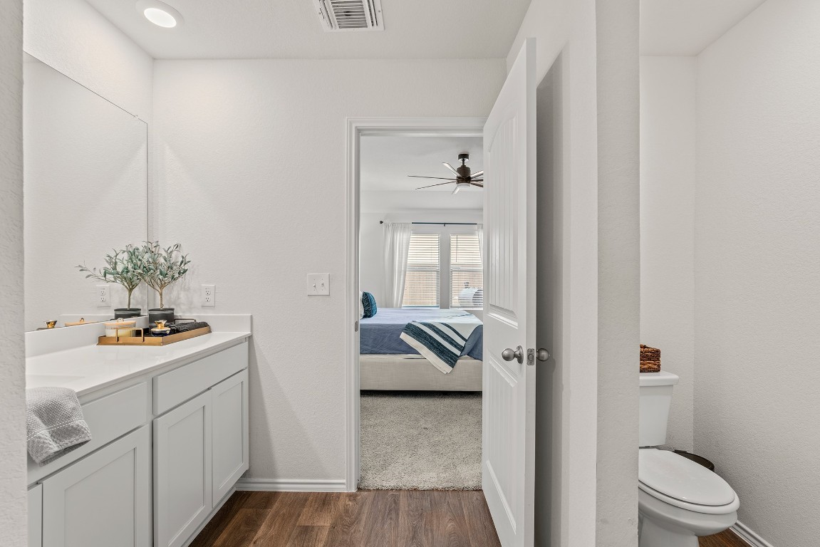 11817 Rush Lane Elgin, TX 78621 - Photo 18 of 30 a en suite bathroom with a toilet sink and shower