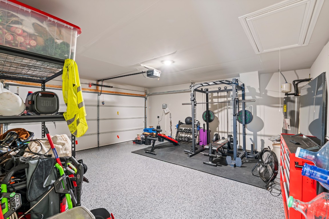11817 Rush Lane Elgin, TX 78621 - Photo 26 of 30 a view of a garage with rack and bicycle