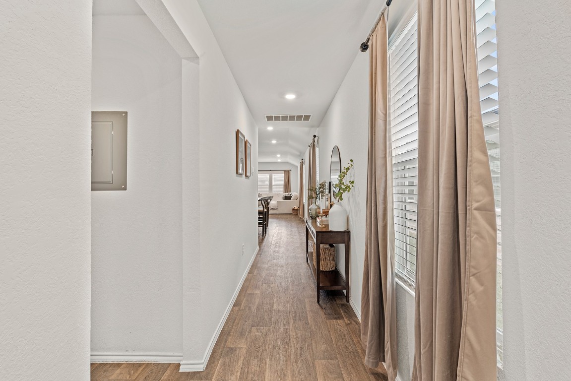 11817 Rush Lane Elgin, TX 78621 - Photo 3 of 30 a view of a hallway with a livingroom with furniture