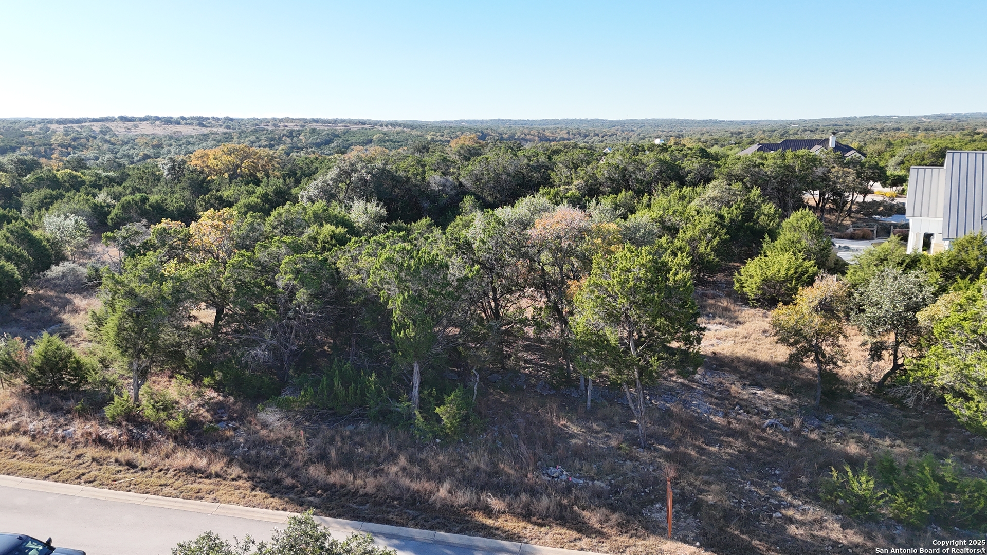 69 Ledgestone Place Boerne, TX 78006 - Photo 2 of 8 a view of a forest with a street