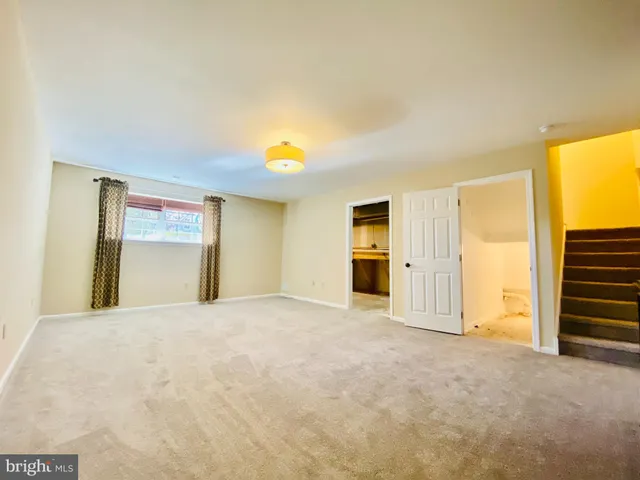 a view of a room with wooden wall