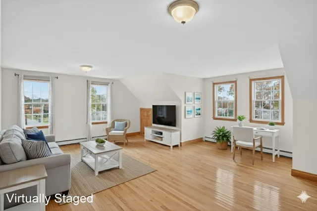 a view of an entryway with wooden floor