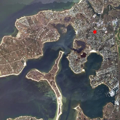 a bathroom with a granite countertop sink a mirror a vanity and a shower