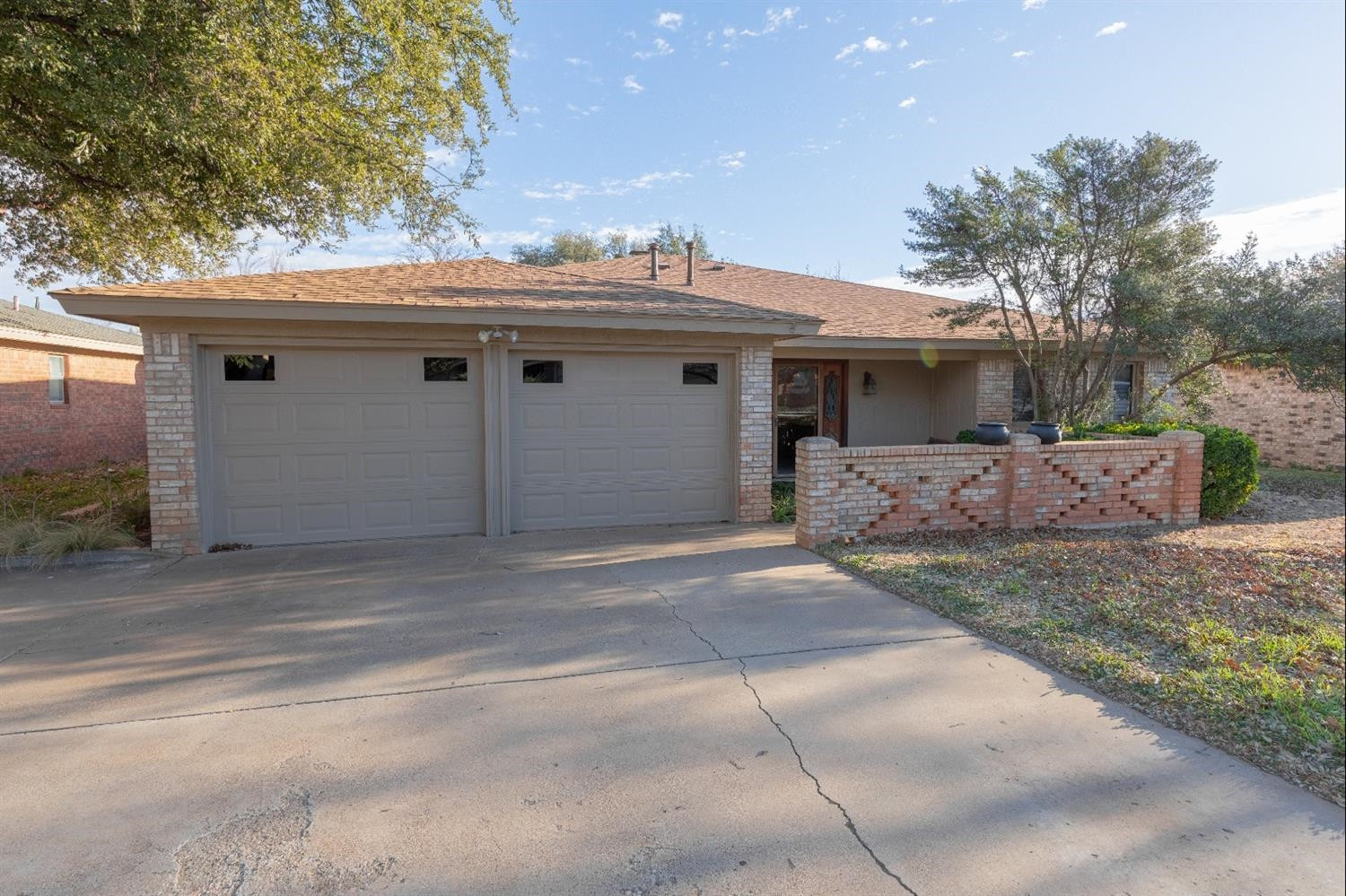 4424 76th Street Lubbock, TX 79424 - Photo 1 of 27 a view of a white house with a outdoor space