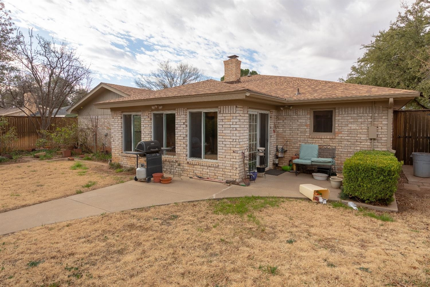 4424 76th Street Lubbock, TX 79424 - Photo 23 of 27 a backyard of a house with seating space