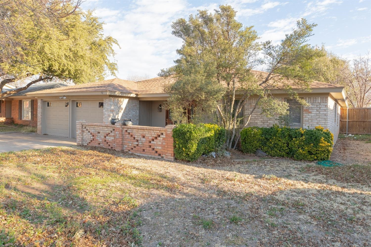 4424 76th Street Lubbock, TX 79424 - Photo 26 of 27 a view of a house with a yard covered in snow