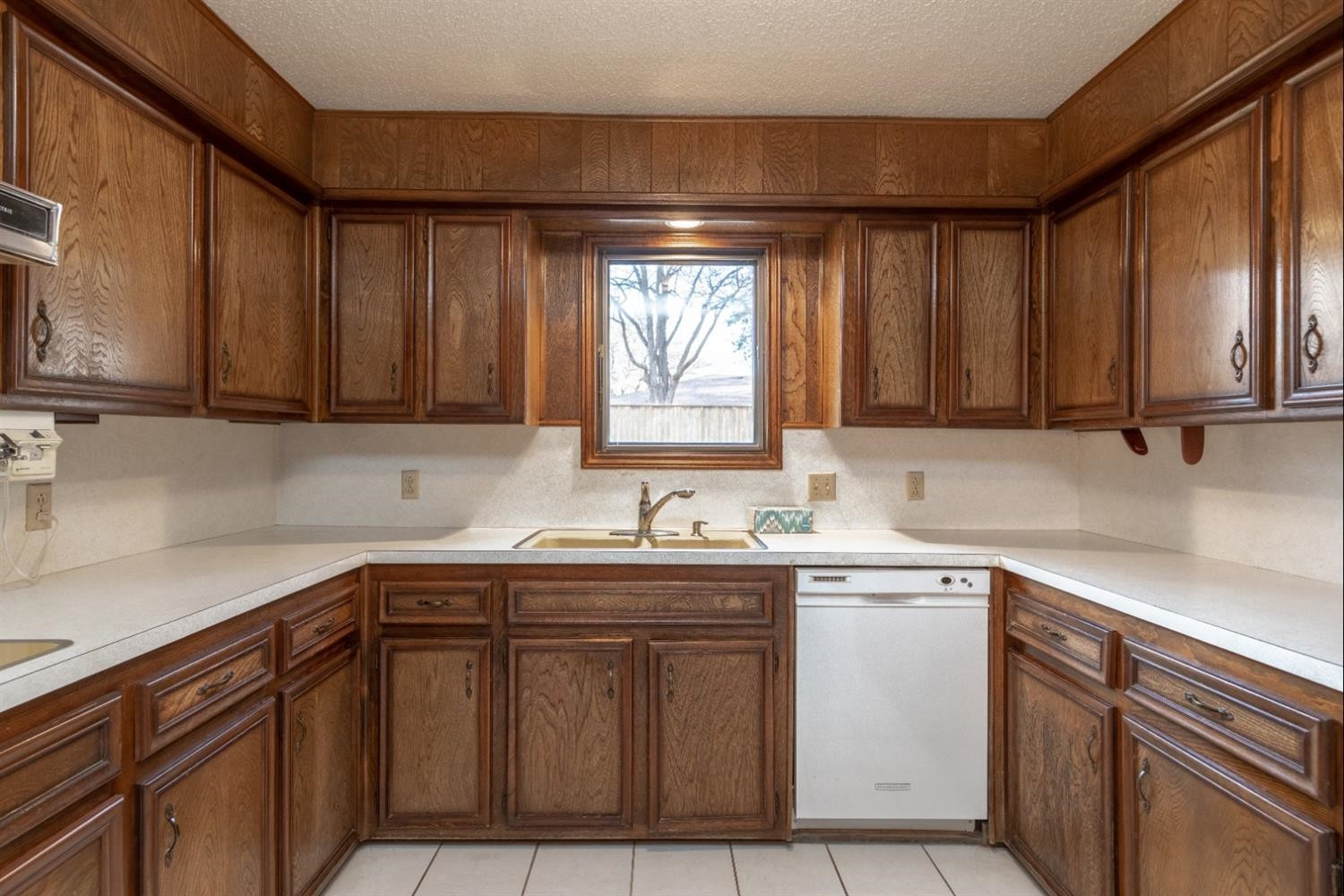 4424 76th Street Lubbock, TX 79424 - Photo 10 of 27 a kitchen with stainless steel appliances granite countertop a sink stove and cabinets