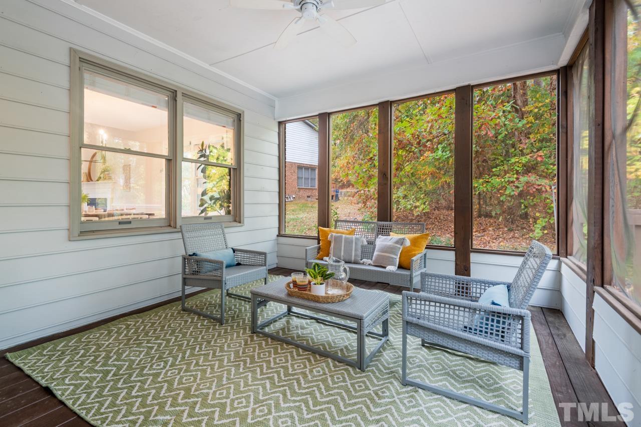 4109 Settlement Drive Durham, NC 27713 - Photo 13 of 31 a living room with furniture and floor to ceiling windows