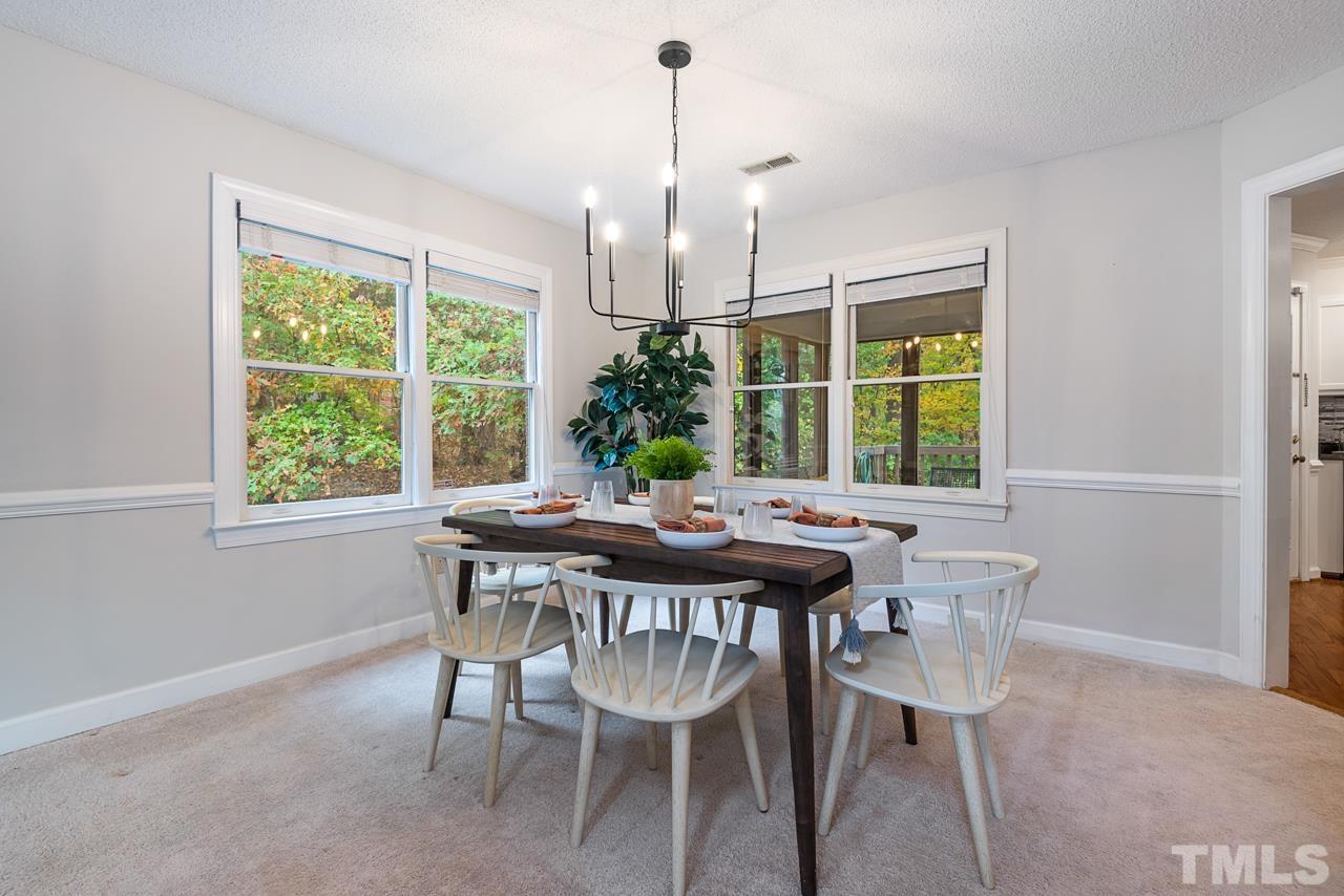4109 Settlement Drive Durham, NC 27713 - Photo 7 of 31 a view of a dining room with furniture window and outside view