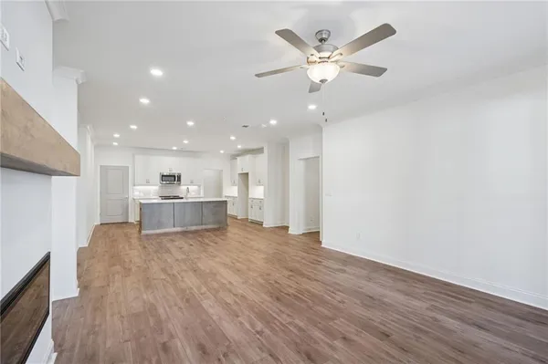 a view of kitchen with cabinet and wooden floor