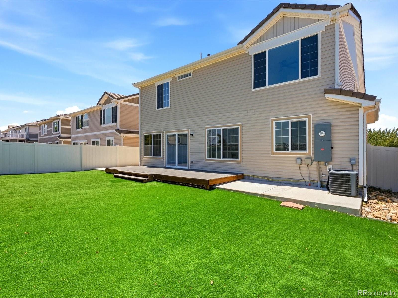 5444 Perth Court Denver, CO 80249 - Photo 42 of 46 a house view with a sitting space and garden