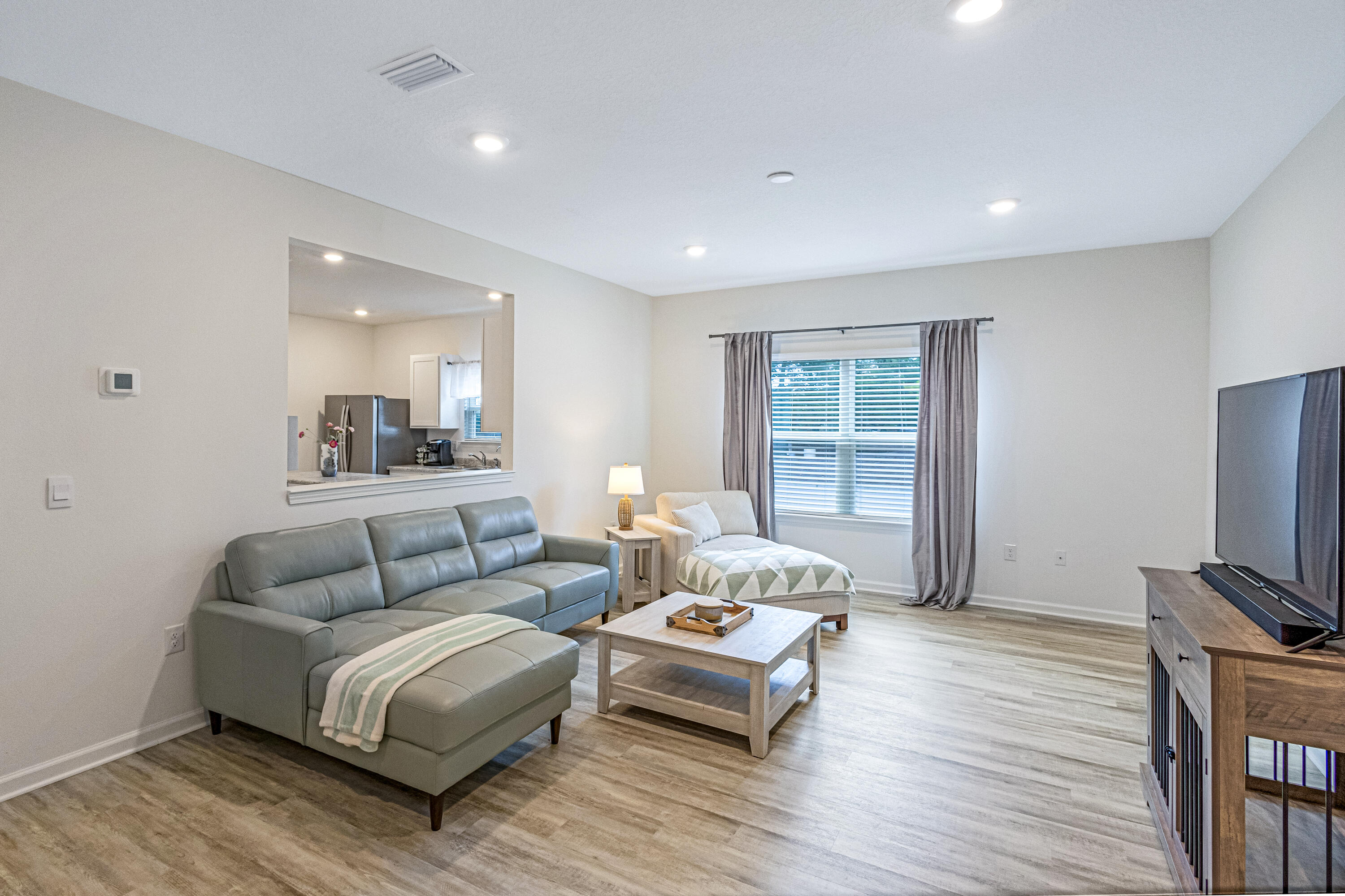 16 Woodsorrel Street Freeport, FL 32439 - Photo 5 of 23 a living room with furniture and a flat screen tv