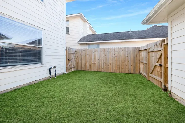 a backyard of a house with lots of green space