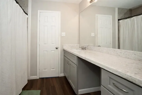 a bathroom with a sink and a mirror