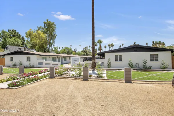 a view of house with outdoor space and sitting area